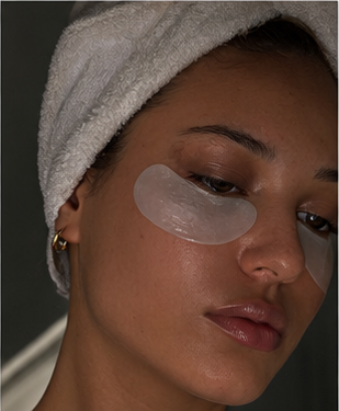 Portrait wearing under-eye skincare patches